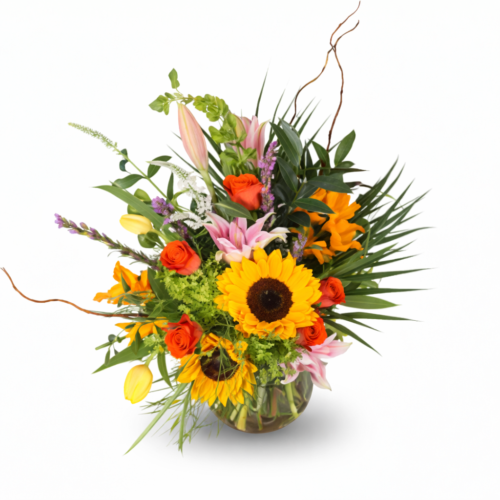 Golden Garden Party: A vibrant floral arrangement in a glass vase with sunflowers, orange roses, pink lilies, and yellow tulips. Perfect for any occasion—order from The Florist at Plantation for reliable Clayton NC flower delivery.