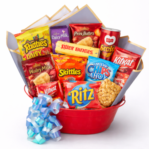 Snack Lover's Dream: A red basket brimming with Skittles, KitKat, Chips Ahoy, Ritz crackers, Cadbury Dairy Milk & more, finished with a blue and white ribbon—crafted by your trusted Clayton florist.