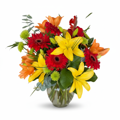 The Sunlit Blooms Vase showcases yellow lilies, red gerbera daisies, orange daisies, and green button poms—expertly arranged by your trusted Local Florist in Clayton—against a white background.