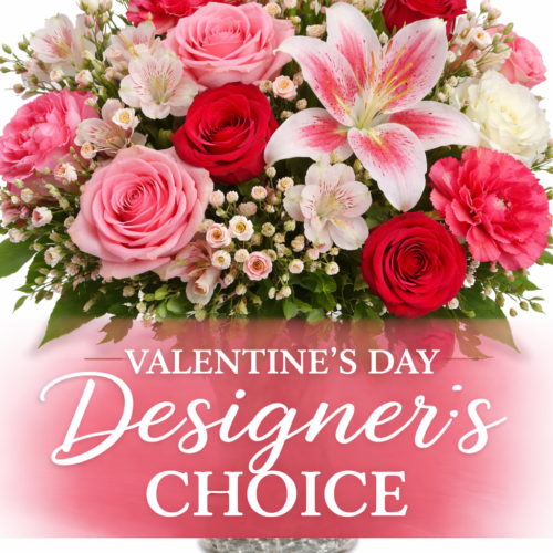 A beautiful mix of red, pink, and white flowers—including roses and lilies—in a glass vase. “Valentine's Day Designers Choice” is the perfect gift from your local Clayton florist.